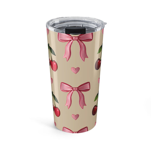 Tumbler with pink bows and cherry designs on a beige background