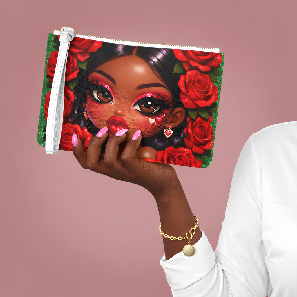 Hand holding a pouch with a colorful design of a face surrounded by roses on a pink background